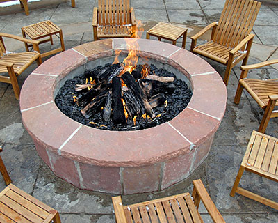 Fire pit paver installation in backyard