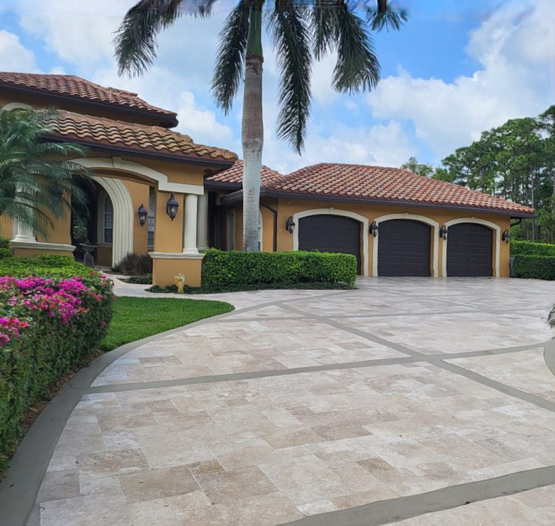 A driveway with porcelain pavers installation in Palm Beach County