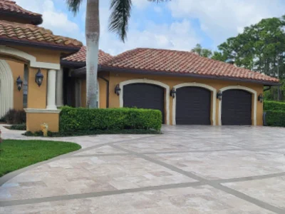 A home with a driveway paver installation in Wellington